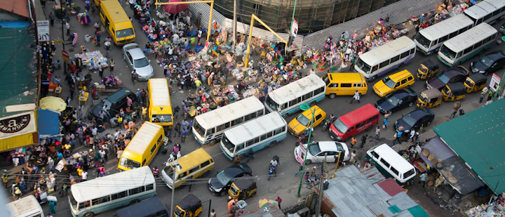 Danfo buses and cars packed into a Lagos junction